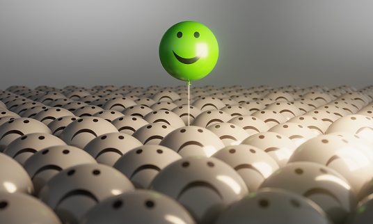 Smiling Sphere Balloon in the middle of grey crowd. ( 3d render )