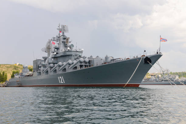 The Guards missile cruiser "Moscow" is the flagship of the Black Sea Fleet at the base July 11, 2021: The Guards missile cruiser "Moscow" is the flagship of the Black Sea Fleet at the base. Sevastopol. Russia. warship stock pictures, royalty-free photos & images