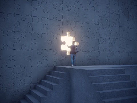 Man climbed up the stairs and trying to push the puzzle piece on the wall and going through the bright light streaming from the hole in the wall. Can be used big idea, innovation, leadership concepts.  (3d render)