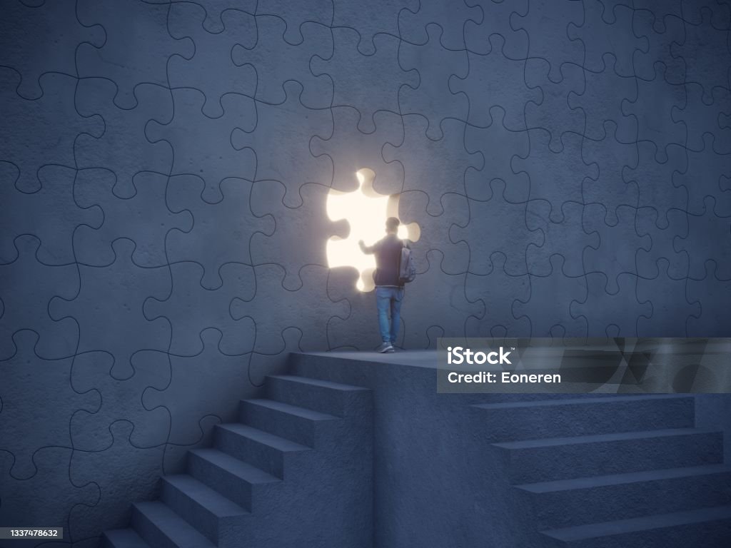 Big Idea Concept Man climbed up the stairs and trying to push the puzzle piece on the wall and going through the bright light streaming from the hole in the wall. Can be used big idea, innovation, leadership concepts.  (3d render) Puzzle Stock Photo