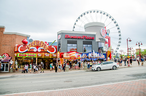 Busy main street of Clifton Hill in Niagara Falls during summer day with all the attractions and restaurants