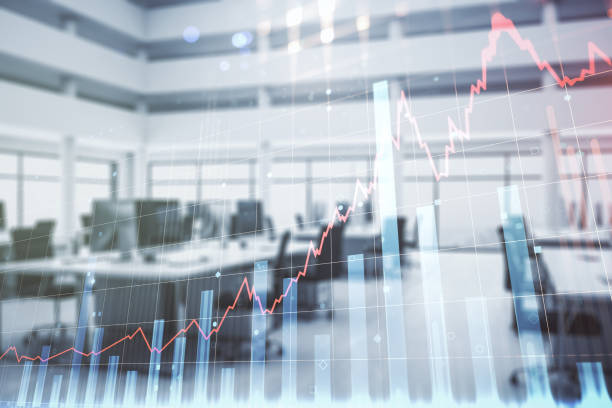 istock Multi exposure of virtual abstract financial graph interface on a modern furnished classroom background, financial and trading concept 1337484591