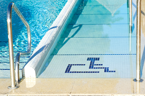 Access to swimming pool for with handicapped symbol
