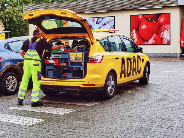 Emergency vehicle of the automobile club ADAC. Berlin, Germany - August 30, 2021: Emergency vehicle of the automobile club ADAC in a supermarket parking lot. adac stock pictures, royalty-free photos & images
