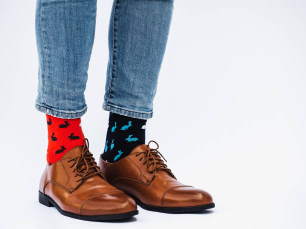 istock Men's legs, trendy shoes and bright socks 1337493280