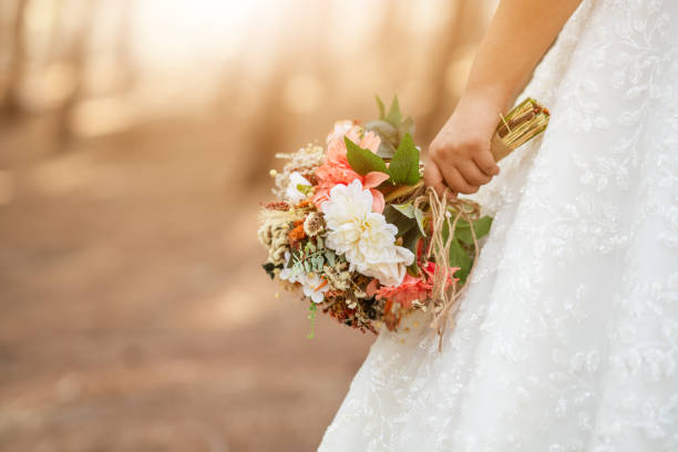 istock Bride holding the colorful and dried wedding bouquet. 1337493540