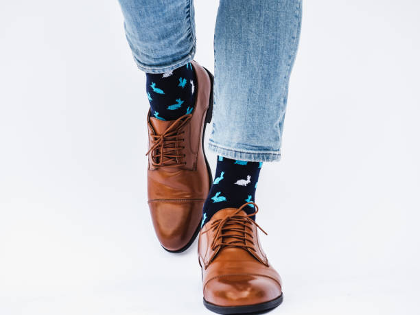 istock Men's legs, trendy shoes and bright socks 1337493783