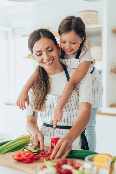 istock Mother and daughter in the kitchen 1337495707