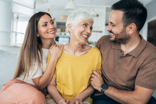 Family Portrait of happy senior woman with her adult offspring mother in law stock pictures, royalty-free photos & images