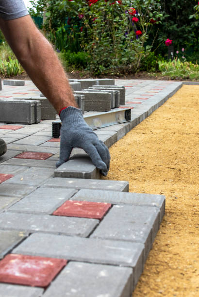istock Hands of worker placing concrete blocks with rubber hammer 1337497037