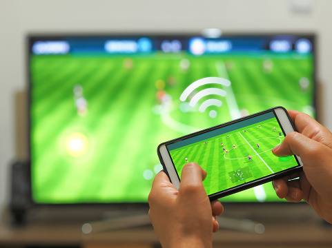 Playing soccer on a TV with a smartphone