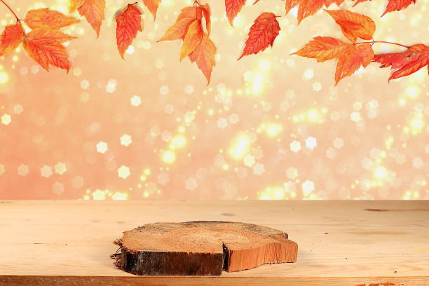 istock Autumn abstract composition with maple leaves on blurred bokeh background and empty wooden table for product presentation, Thanksgiving day concepts 1337503401