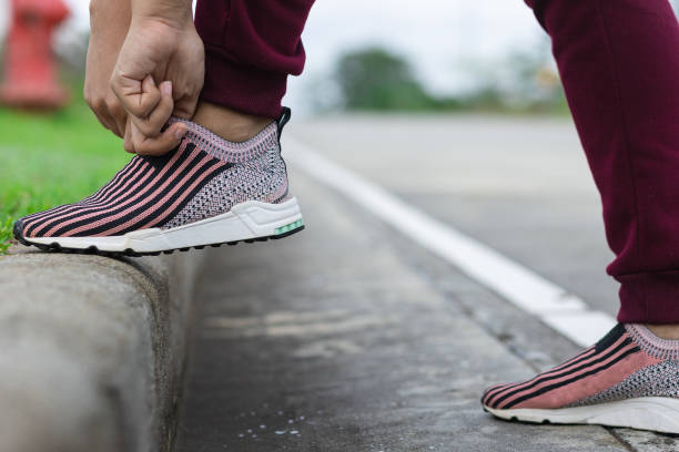 istock Latin girl fixing her shoes 1337507362