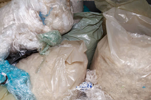 istock Sorted plastic and polyethylene for recycling. Factory garbage warehouse background. 1337508200