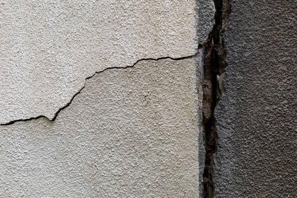 istock Crack in the wall. Rough textured surface. A background for a blank 1337508367
