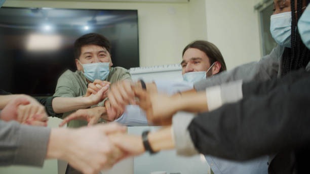 istock Young businessmen are having fun and clapping their hands 1337509272