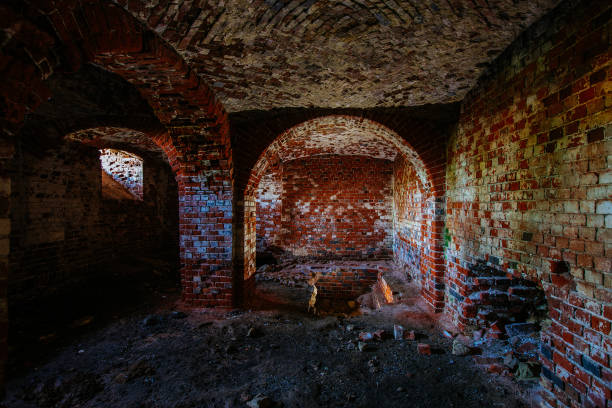 istock Dark and creepy vaulted red brick dungeon 1337510348