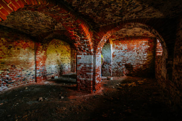 istock Dark and creepy vaulted red brick dungeon 1337510350