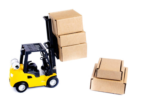 istock Mini forklift truck load cardboard boxes isolated on white background. Logistics and transportation management ideas and Industry business commercial concept. 1337512188