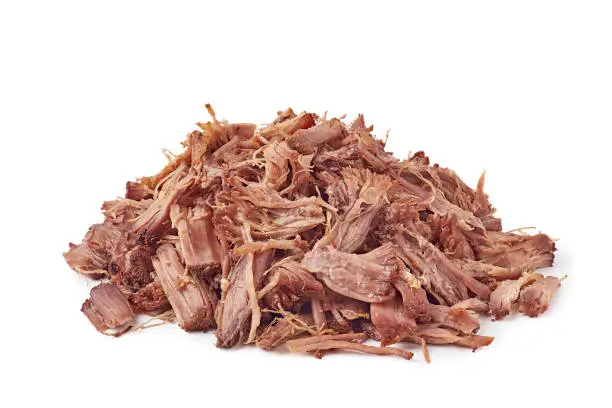 Photo of Heap of shredded beef on white