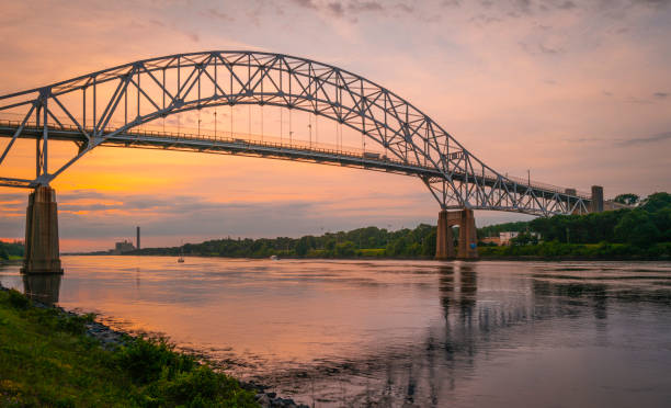 istock Arching steel bridge over the canal at sunrise 1337514973