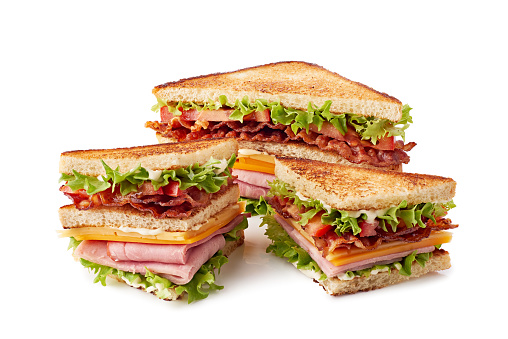 Sliced club sandwich isolated on white. Clipping path included