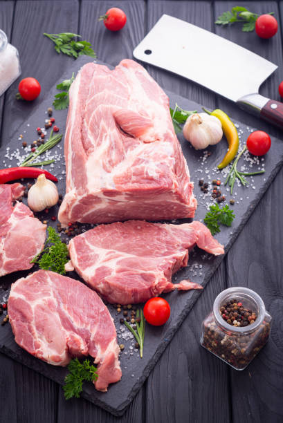 istock Raw pork neck with spices and herbs 1337521113