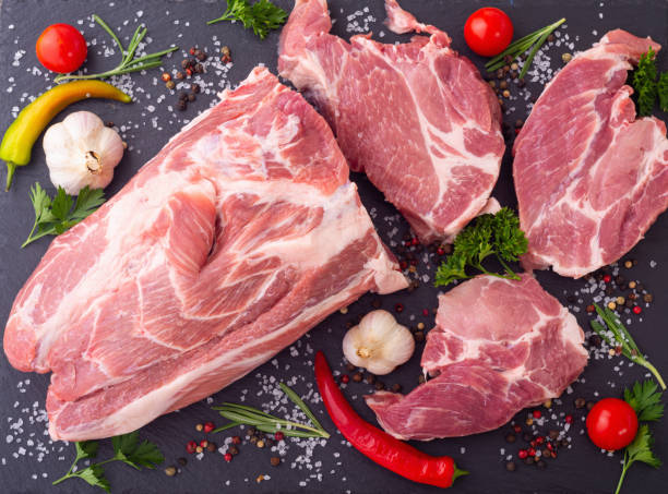 istock Raw pork neck with spices and herbs 1337521116