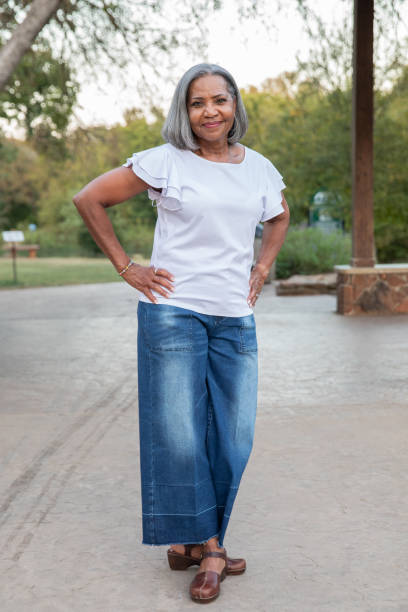 Senior woman smiles while looking at the camera
