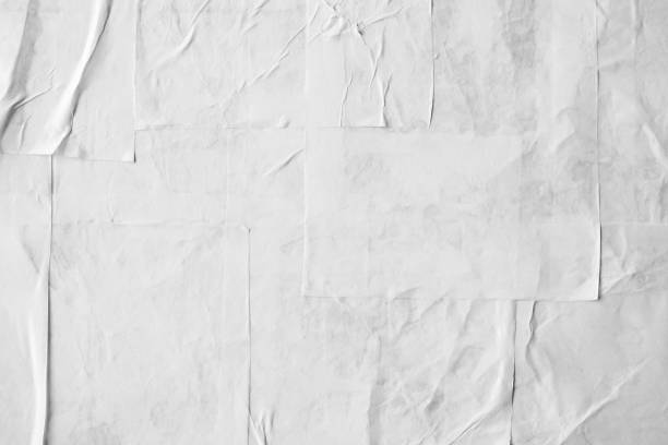 istock Blank white crumpled and creased paper poster texture 1337523381