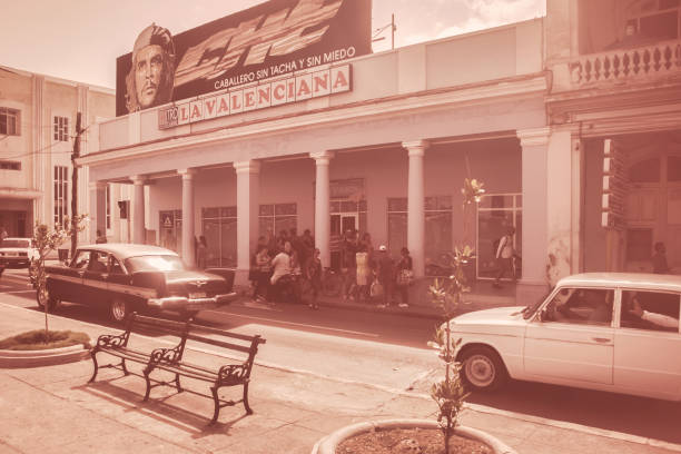 Cienfuegos, Cuba - July 13 2018 : Nostalgic classic cars on the streets of Cienfuegos in a 50s setting.