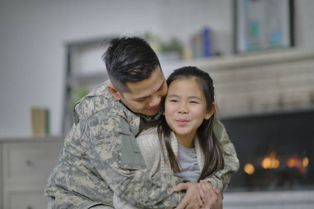 istock Military father hugging his daughter 1337525554
