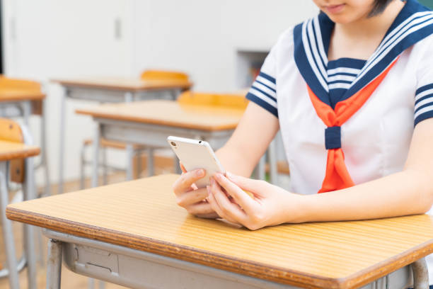 istock schoolgirl studying in the classroom,tablet computer,hands, 1337533033