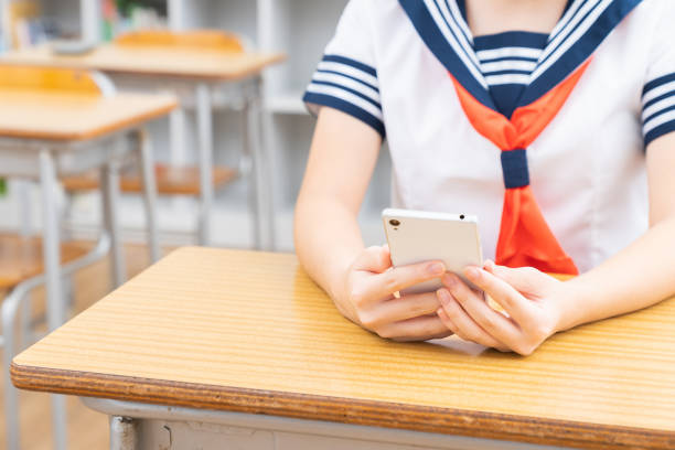 istock schoolgirl studying in the classroom,tablet computer,hands, 1337533130