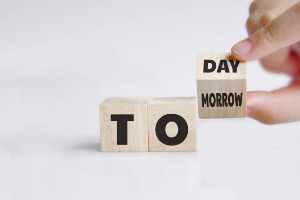 istock Hand turns a dice and changes the word 