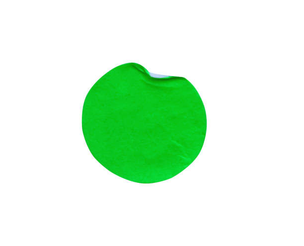 istock Blank green circle adhesive paper sticker label  with a folded edges isolated on white background , clipping path 1337546843