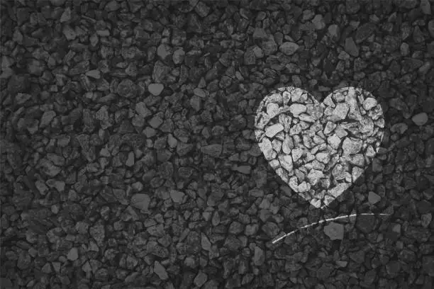 Vector illustration of Black and white coloured pebbles making a heart painted on gravel road; Valentine's Day or anniversary love greetings related vector backgrounds
