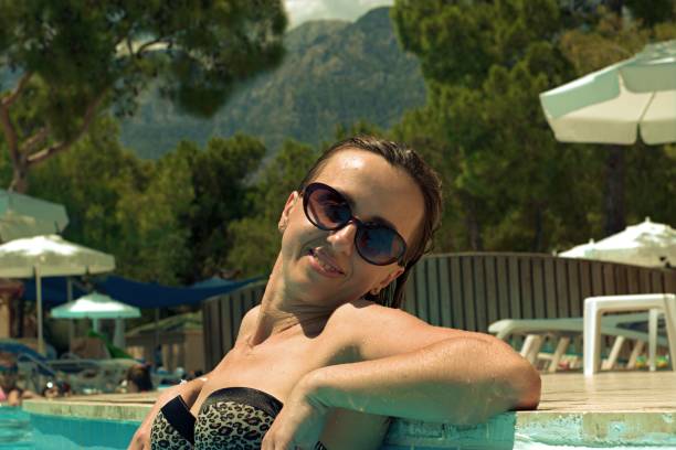 istock Hot girl resting in the pool 1337551285