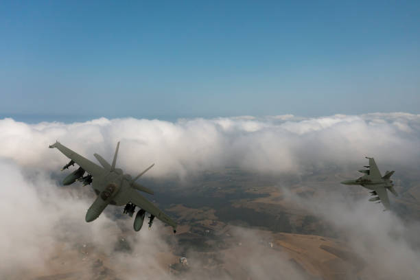 istock Jet fighters flying over the clouds. 1337551314