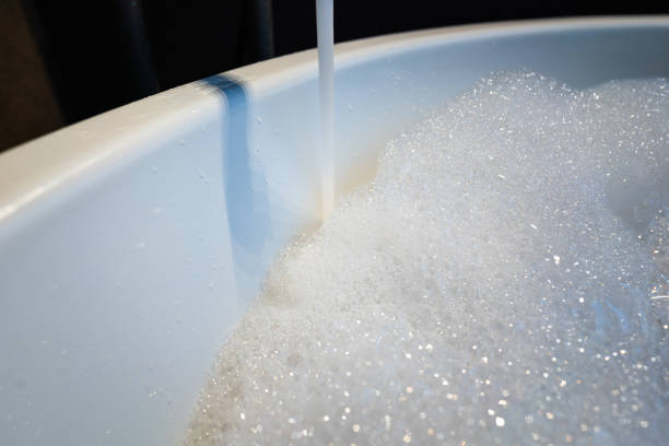 istock Water flowing from vintage designed tap into a bathtub. 1337554285