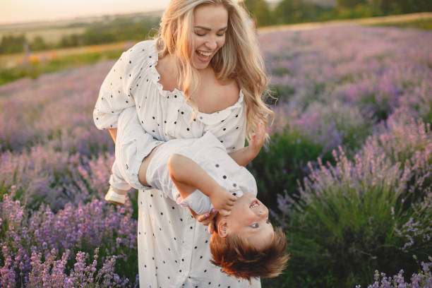 istock Little boy with her mother in a lavender field 1337555824