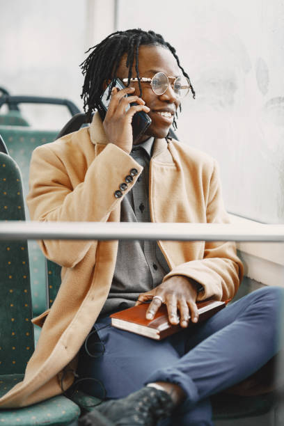 istock Young African businessman sitting in a bus 1337555894