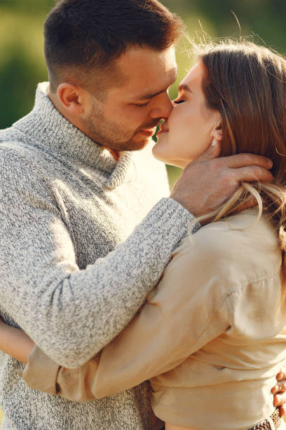 istock Beautiful couple spend time on a summer field 1337558216