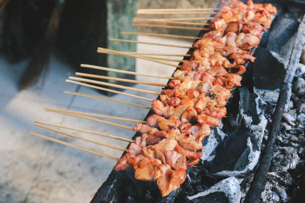 istock Sate Kambing or goat satay on red fire grilling by people. 1337558479