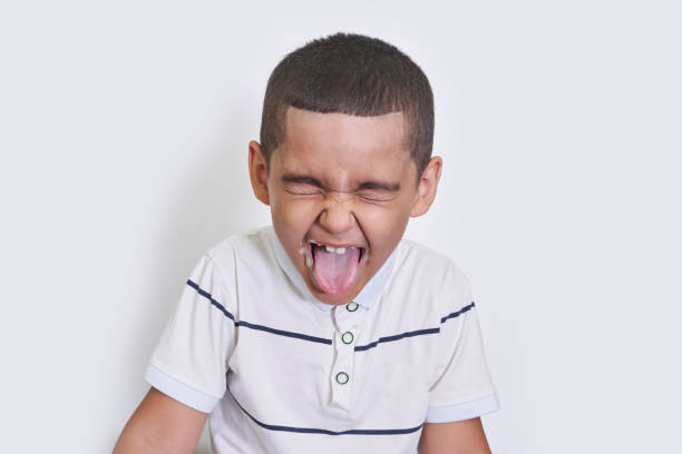 istock A funny boy sticking tongue out 1337559207
