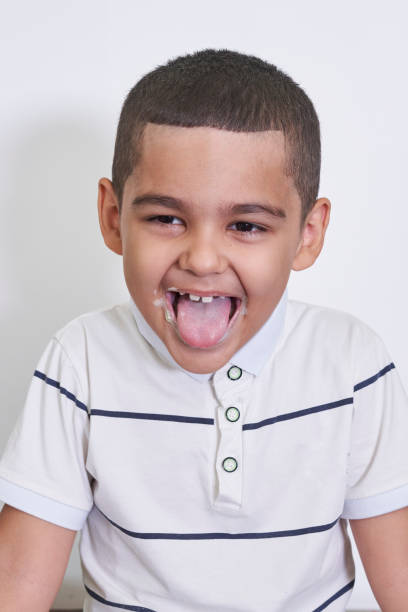 istock A funny boy sticking tongue out 1337559259