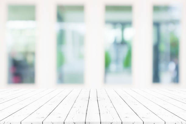 istock Perspective empty white wooden table on top over blur background, can be used mock up for montage products display or design layout. 1337559266