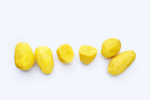 istock Raw peeled potatoes on white background 1337562098