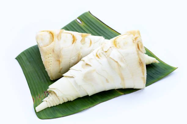 istock Bamboo shoots on banana leaf on white 1337562125