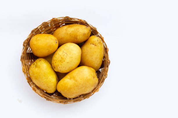istock Fresh potatoes in bamboo basket on white background. 1337563325